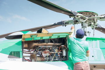 Engineer maintaining a helicopter Engine © papi8888
