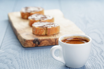 simple breakfast with cup of espresso and baguette slices with