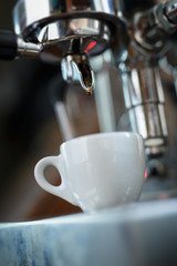 preparing espresso on professional coffee machine