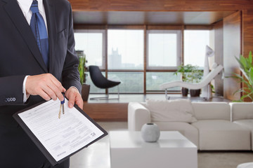Businessman gives keys for the contract