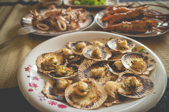 Grilled Fresh Scallops With Butter And Herb On Flaming Grill (vintage Color)