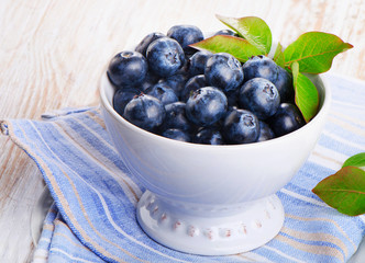 Fresh blueberries in white bowl