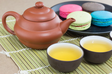 Teapot and macaroon dessert