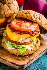 home burger with vegetables, barbecue sauce and chicken cutlet
