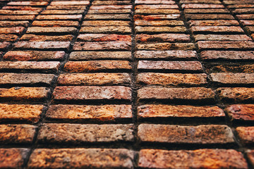 Side view of brown brick wall