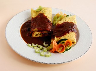 pancakes with vegetable filling and spicy sauce