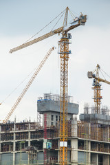 Fototapeta na wymiar Industrial construction cranes