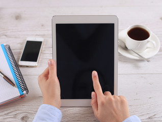 Digital tablet computer with isolated screen in female hands