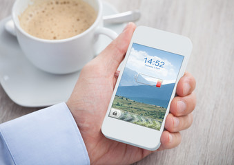 Hand Holding Mobile Phone With Low Battery