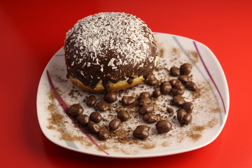 Isolated chocolate donut and chocolate balls with cocoa powder
