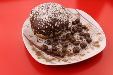 Isolated chocolate donut and chocolate balls with cocoa powder