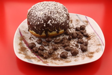 Isolated chocolate donut and chocolate balls with cocoa powder