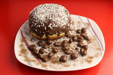 Isolated chocolate donut and chocolate balls with cocoa powder