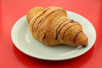 Isolated single chocolate croissant