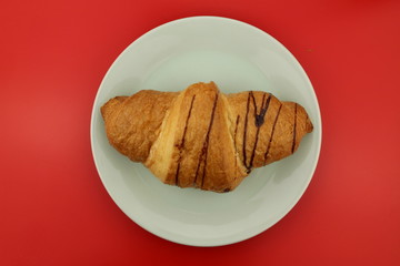 Isolated single chocolate croissant