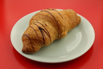 Isolated single chocolate croissant