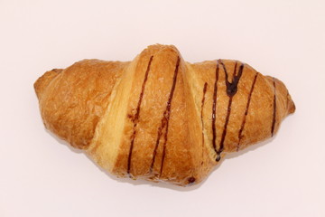 Isolated single chocolate croissant