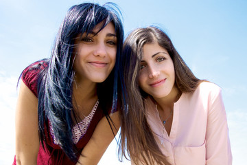 Fototapeta premium Smiling beautiful girls looking camera