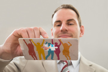 Businessman Making Human Figure