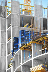 Building construction site work against blue sky