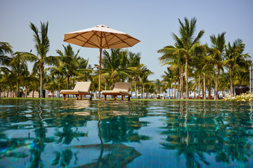 Fototapeta na wymiar Luxury swimming pool a tropical resort