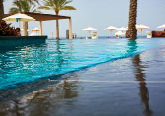 Fototapeta premium Luxury swimming pool a tropical resort