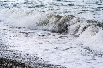 Sea waves on a pebbly shore