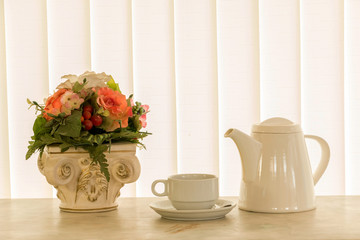 Fototapeta na wymiar Coffee cup on white curtain background