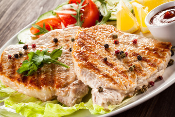 Grilled steaks and vegetable salad