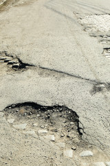 Very bad quality road with potholes