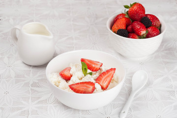 cottage cheese with fresh strawberries in the bowl