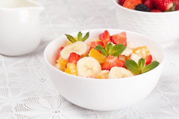 Fruit and berry salad for breakfast, horizontal, closeup