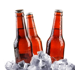 Glass bottles of beer isolated on white