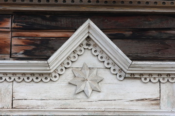 Traditional wooden Russian carved platband of an old house