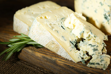 Blue cheese on wooden cutting board. closeup