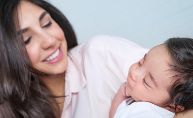 Happy mother with baby