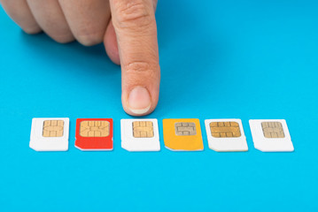 Person Hand Selecting Sim Card