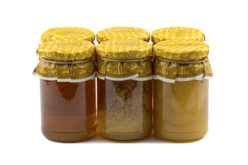 Jars of honey isolated white