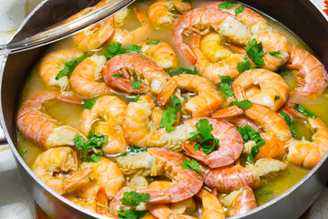 Shrimp cooking with parsley