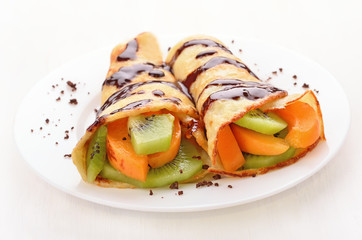Crepes with fruit slices