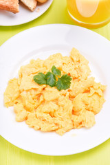 Scrambled eggs on white plate