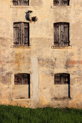 Detail of the facade of an old abandoned house