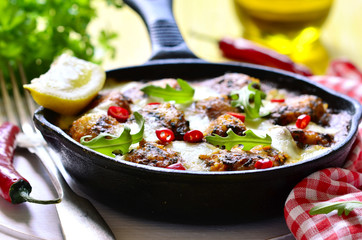 Fish meatball baked in frying pan.