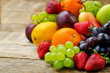 Fototapeta na wymiar fruits. mango, lemon, plum, grape, pear, orange, Apple, banana,