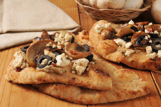 Naan bread with Mediterranean toppings
