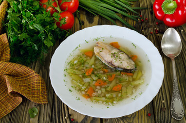Homemade soup of fish and pearl barley