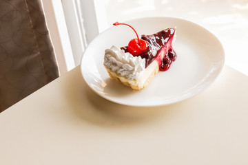 blueberry cheese cake with cherry on top