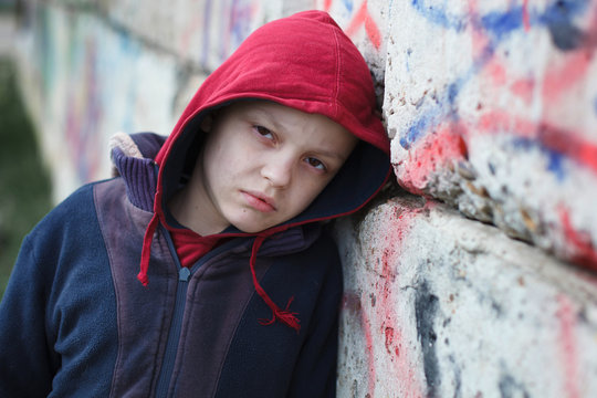 dramatic portrait of a homeless boy