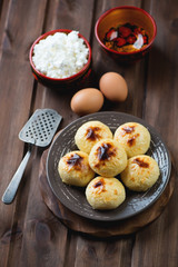 Cottage cheese pancakes and cooking ingredients, studio shot