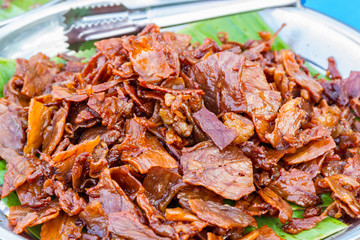 Slice of Baked  carameled pork belly.